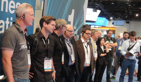 a trade show environment with the presenter and group