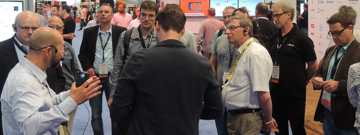 a trade show environment with the presenter and group